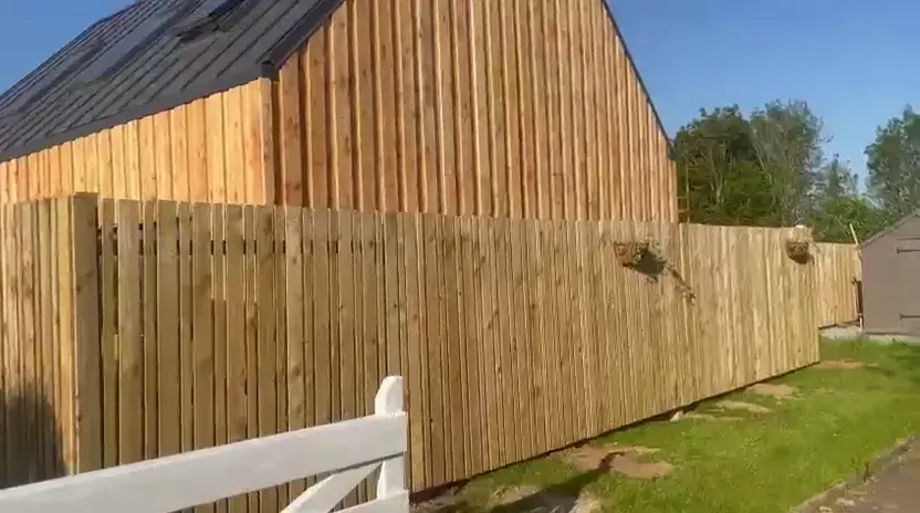 Vertical timber cladding boards on a gabled building elevation