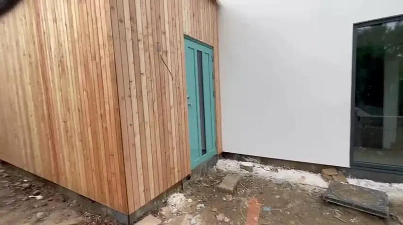 Completed vertical timber cladding on the extension elevation