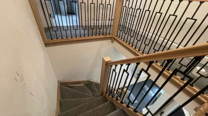 Decorative metal balusters with a timber handrail