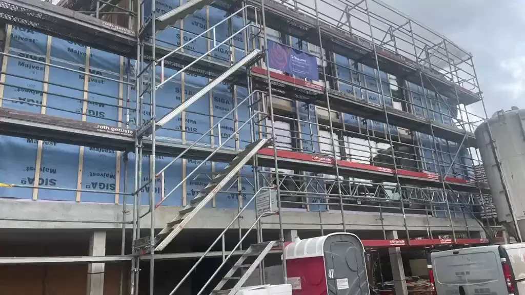 Window openings and reveals formed across the facade