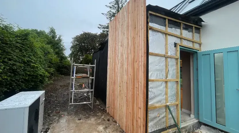 Vertical timber cladding boards begin going up