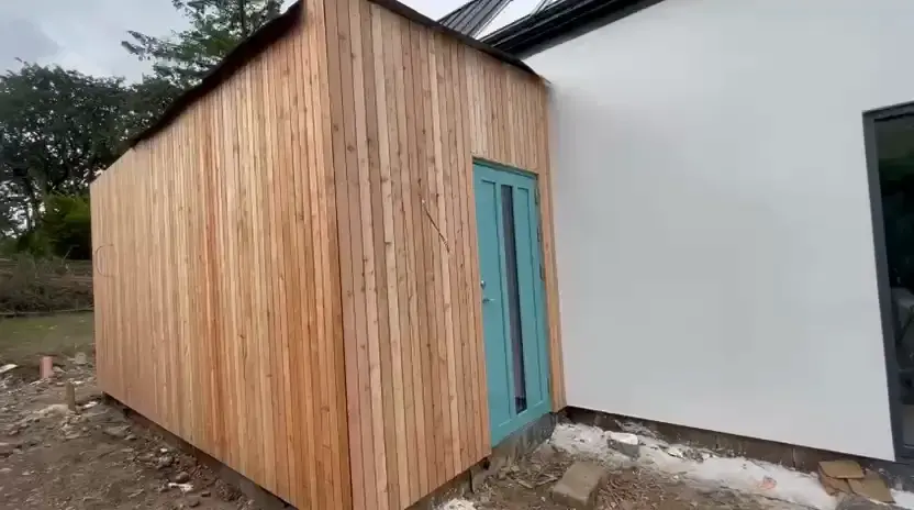The completed vertical timber cladding to the extension elevation